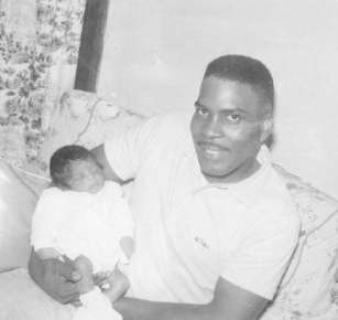 The Late James Campbell Sr. holding baby Carol Ann